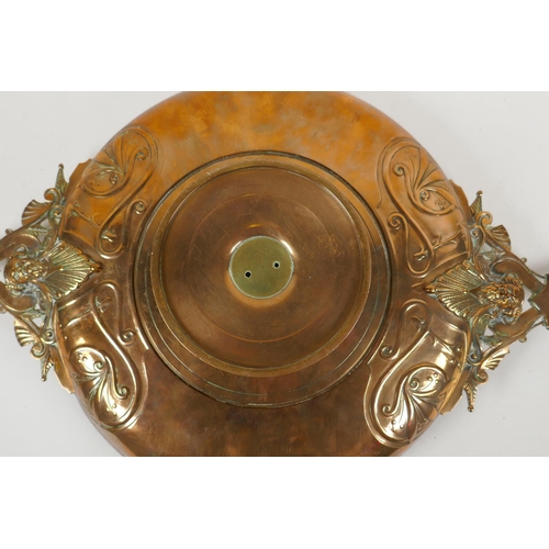 236 - A Barbedienne bronze tazza, the centre embossed with horses and riders, the handles supported on Bac... 