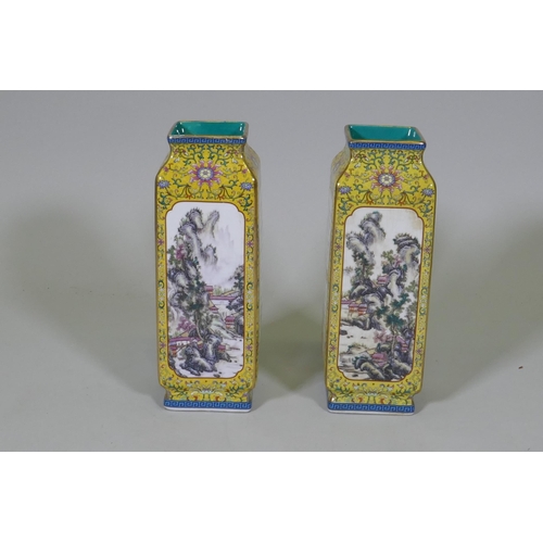 237 - A pair of Chinese yellow glazed vases, with enamelled paintings of landscapes and poems set in panel... 