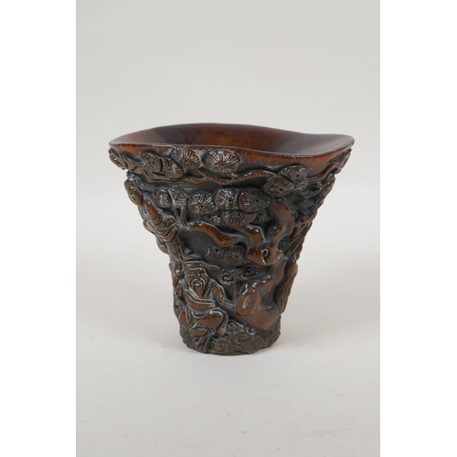 240 - A Chinese faux horn libation cup with carved decoration of the Eight Immortals, 4 character mark to ... 