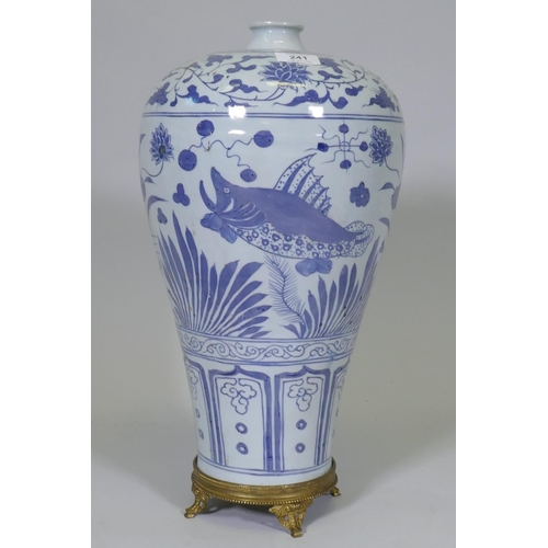 241 - A Chinese ming style blue and white baluster shaped vase decorated with carp amongst reeds and lotus... 