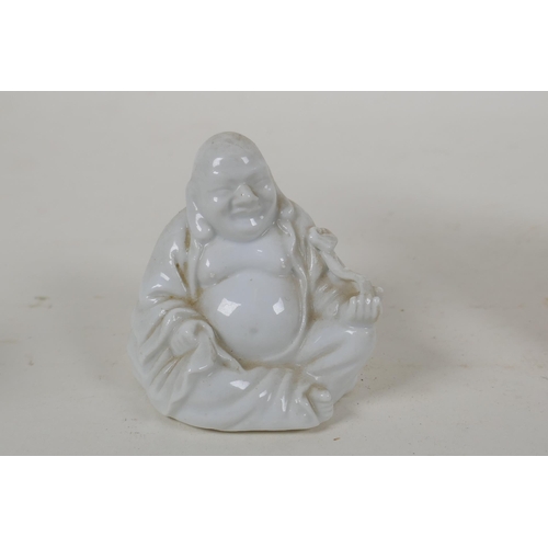 243 - A Chinese blanc de chine porcelain Guan Yin, together with a smaller blanc de chine Buddha and a pol... 