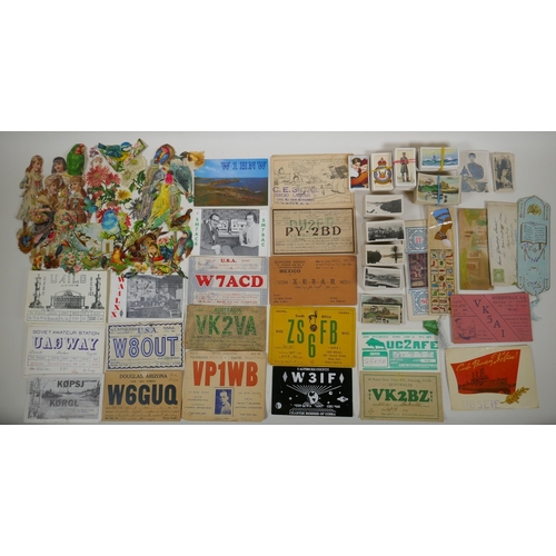 245 - A quantity of assorted ephemera to include vintage scraps for scrapbooking, vintage QSL radio cards ... 