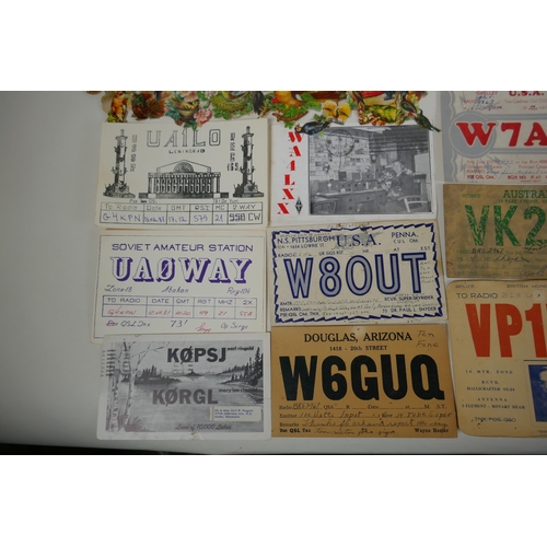 245 - A quantity of assorted ephemera to include vintage scraps for scrapbooking, vintage QSL radio cards ... 