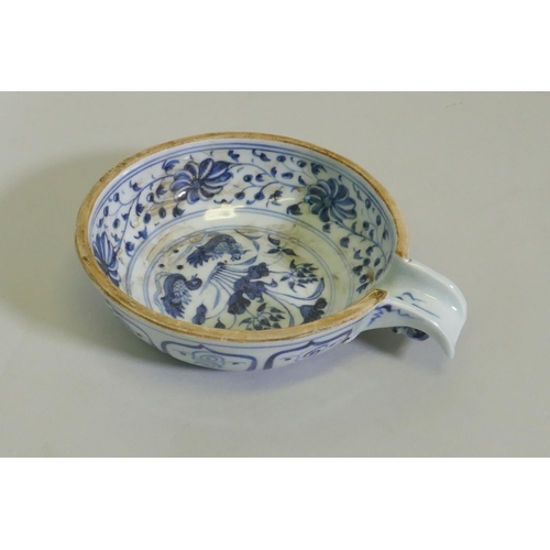 246 - A Chinese blue and ceramic pourer decorated with ducks on a pond, 15cm diameter