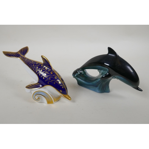 248 - A Royal Crown Derby porcelain dolphin paperweight, together with a Poole Pottery dolphin, largest 15... 