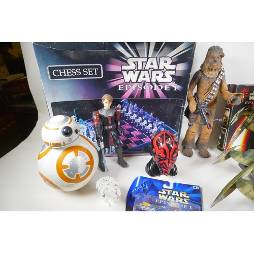 249 - A collection of Star Wars toys, to include a chess set, action figure, starships and moneybox