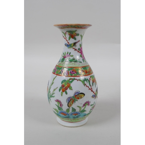 272 - A late C19th Cantonese famille vert porcelain vase decorated with birds and butterflies amongst flow... 