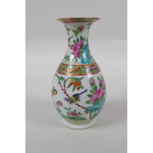 272 - A late C19th Cantonese famille vert porcelain vase decorated with birds and butterflies amongst flow... 