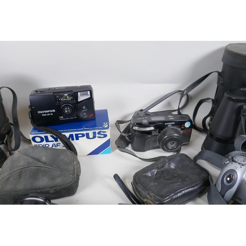 278 - A collection of cameras and equipment, to include an Olympus PEN-EE, an Olympus Trip 35, an Olympus ... 