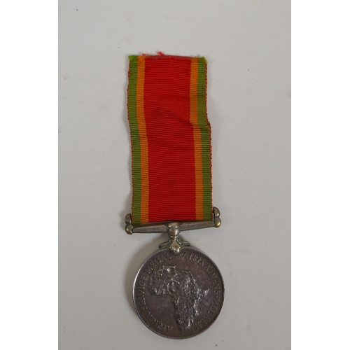 29 - A WWII Africa Service medal awarded to W.R. McLeod 75468, a silver Air Raid Precautions (ARP) lapel ... 