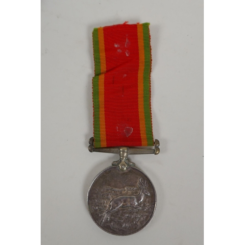 29 - A WWII Africa Service medal awarded to W.R. McLeod 75468, a silver Air Raid Precautions (ARP) lapel ... 