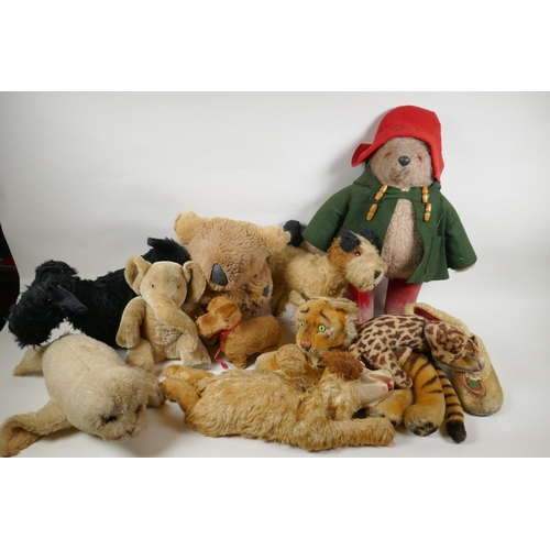 291 - A collection of vintage stuffed toys including an Angus Terrier, plush dog with rubber head, clockwo... 