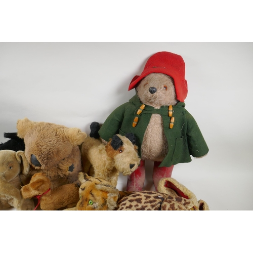 291 - A collection of vintage stuffed toys including an Angus Terrier, plush dog with rubber head, clockwo... 