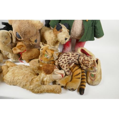 291 - A collection of vintage stuffed toys including an Angus Terrier, plush dog with rubber head, clockwo... 