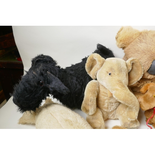 291 - A collection of vintage stuffed toys including an Angus Terrier, plush dog with rubber head, clockwo... 