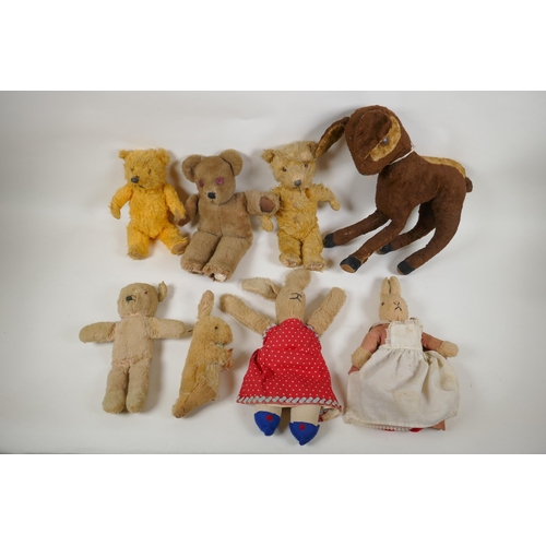 297 - A collection of vintage plush toys, including a Bambi deer, three rabbits and four antique teddy bea... 