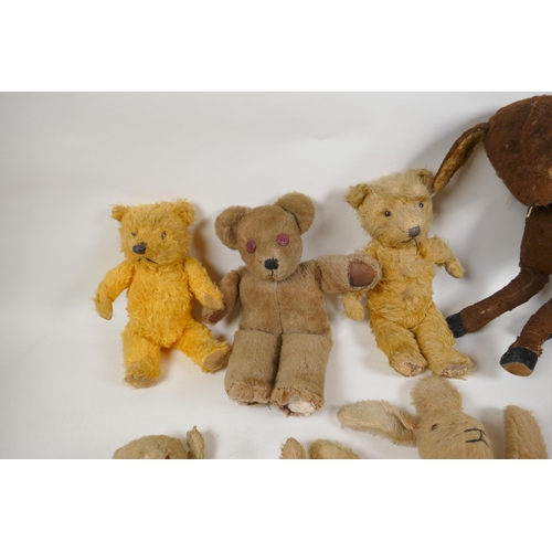 297 - A collection of vintage plush toys, including a Bambi deer, three rabbits and four antique teddy bea... 