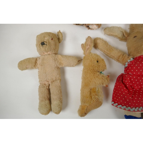 297 - A collection of vintage plush toys, including a Bambi deer, three rabbits and four antique teddy bea... 