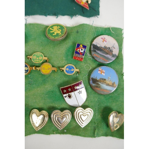 33 - A collection of vintage enamel pins and badges including Disney, Manchester United, Variety Club, bo... 