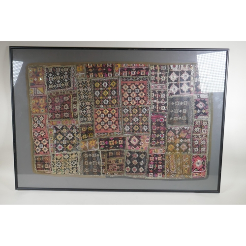 42 - An antique Pakistani mirror embroidery wall hanging with gilt thread, framed, 89 x 58cm