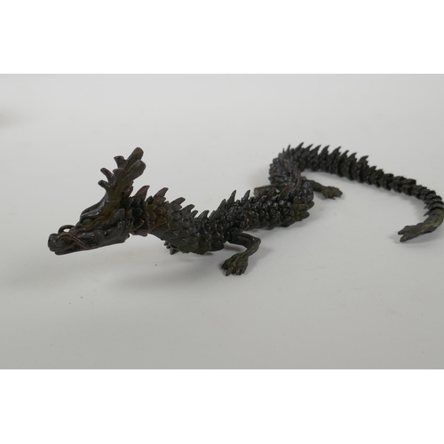 48 - A Japanese Jizai style bronzed metal okimono dragon with articulated parts, 38cm long