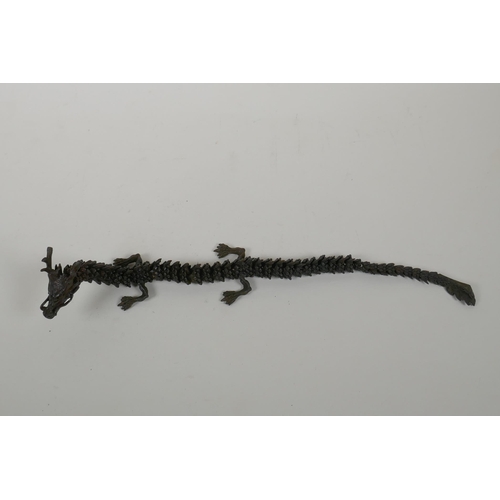 48 - A Japanese Jizai style bronzed metal okimono dragon with articulated parts, 38cm long