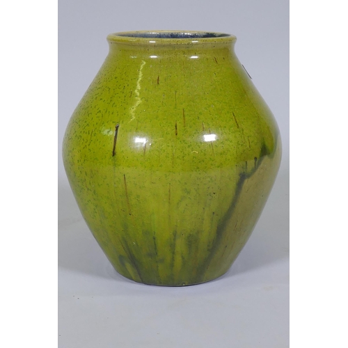 5 - Dora Lunn, a Ravenscourt pottery vase of baluster form with mottled drip green glaze, 28cm high