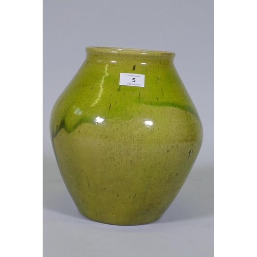 5 - Dora Lunn, a Ravenscourt pottery vase of baluster form with mottled drip green glaze, 28cm high