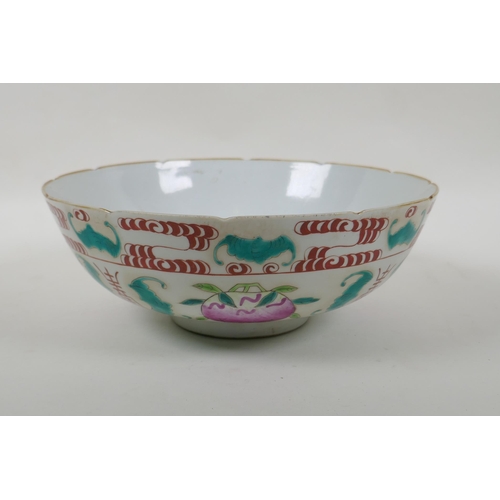 50 -  A Chinese Qing Dynasty famille rose porcelain bowl decorated with peaches, bats and auspicious... 