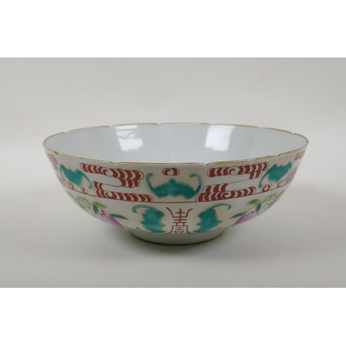 50 -  A Chinese Qing Dynasty famille rose porcelain bowl decorated with peaches, bats and auspicious... 