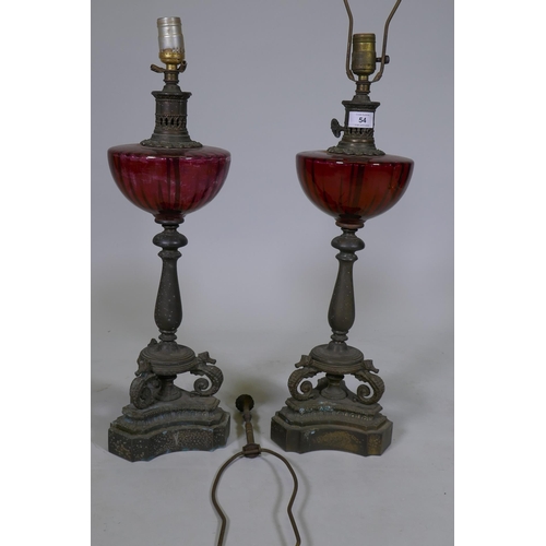 54 - A pair of vintage table lamps with glass bowls raised on brass columns with seahorse supports, 60cm ... 