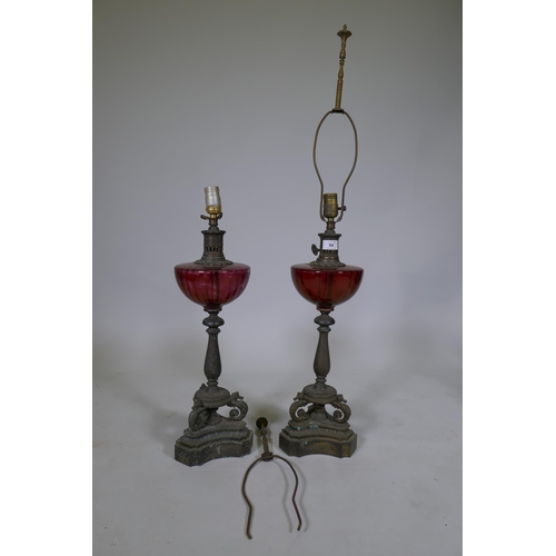 54 - A pair of vintage table lamps with glass bowls raised on brass columns with seahorse supports, 60cm ... 