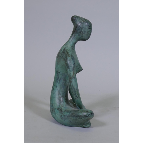 55 - A contemporary bronze figure of a seated nude, 27cm high, unsigned