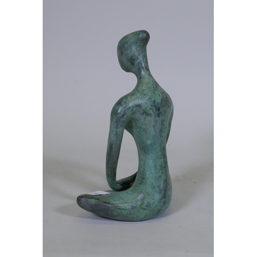 55 - A contemporary bronze figure of a seated nude, 27cm high, unsigned