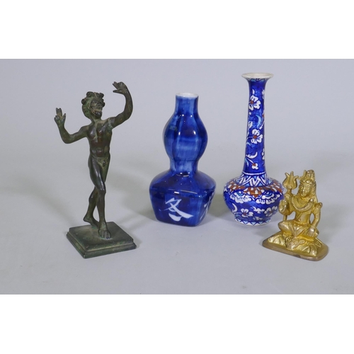 57 - A brass figure of a fawn after the antique, 15cm high, another of Shiva, a North African ceramic bud... 