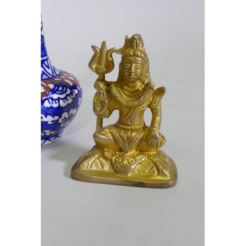 57 - A brass figure of a fawn after the antique, 15cm high, another of Shiva, a North African ceramic bud... 