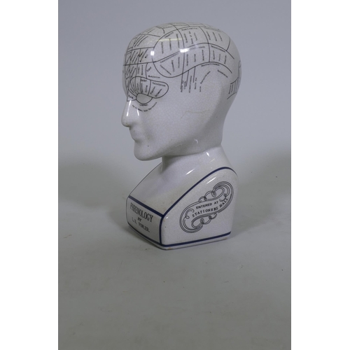 58 - A ceramic phrenology head, 24cm high