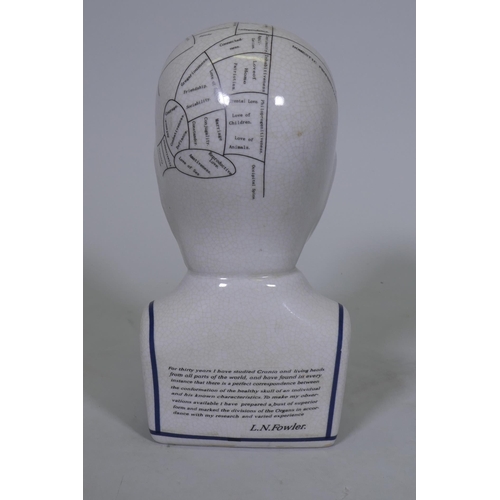 58 - A ceramic phrenology head, 24cm high