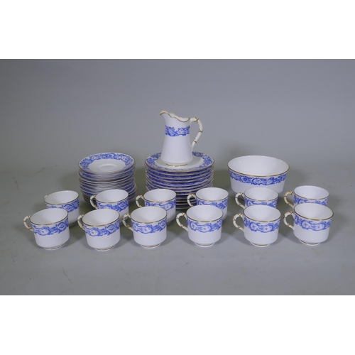 60 - A Royal Worcester twelve place porcelain tea set with blue transfer and gilt decoration, pattern no.... 