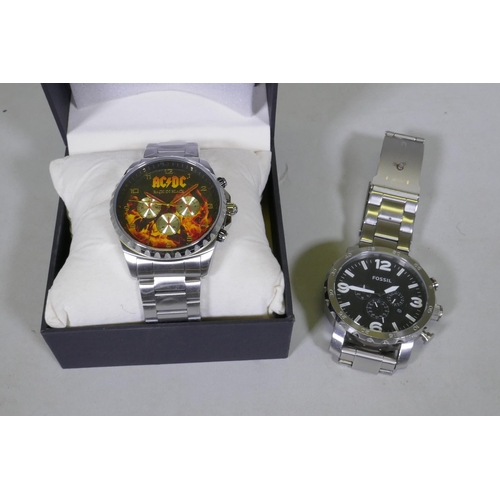 604 - A Fossil stainless steel gentleman's wristwatch, appears working order, and an AC/DC Back to Black 4... 