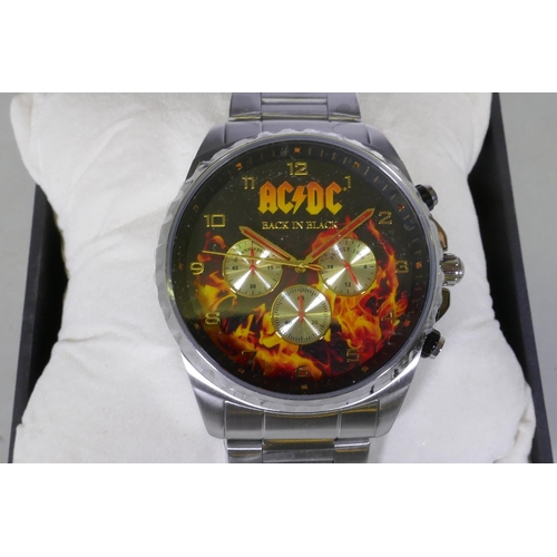 604 - A Fossil stainless steel gentleman's wristwatch, appears working order, and an AC/DC Back to Black 4... 