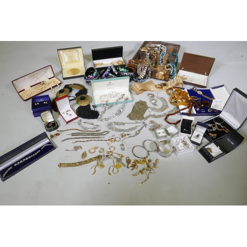 612 - A quantity of costume jewellery including silver, amber, hand painted bangles etc