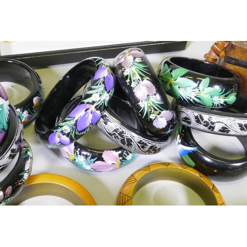 612 - A quantity of costume jewellery including silver, amber, hand painted bangles etc