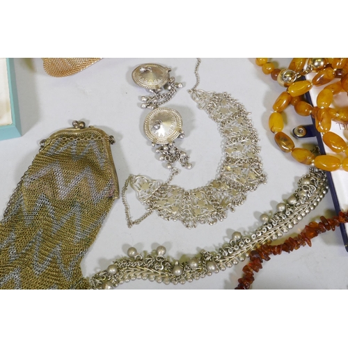 612 - A quantity of costume jewellery including silver, amber, hand painted bangles etc