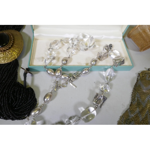 612 - A quantity of costume jewellery including silver, amber, hand painted bangles etc