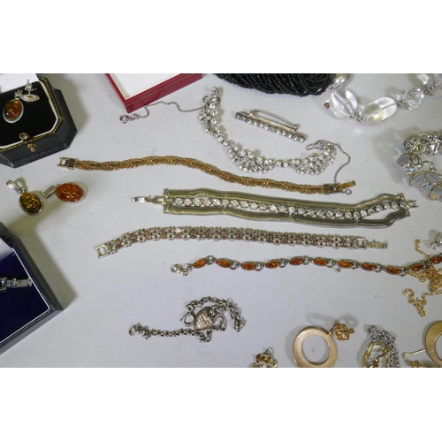 612 - A quantity of costume jewellery including silver, amber, hand painted bangles etc