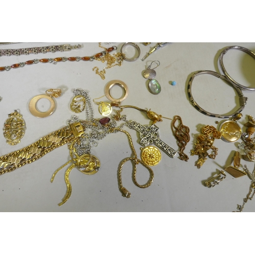 612 - A quantity of costume jewellery including silver, amber, hand painted bangles etc