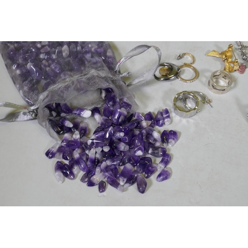 624 - A quantity of costume jewellery, silver rings, jade pendant necklace, uncut amethysts gem stones, Sw... 