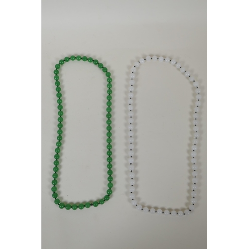 627 - An apple green jade bead necklace, and a similar white jade bead necklace, longest 70cm