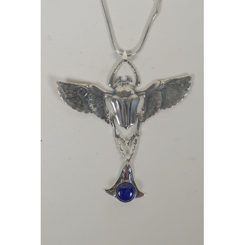 629 - A sterling silver pendant necklace in the form of a winged beetle, 9cm wide